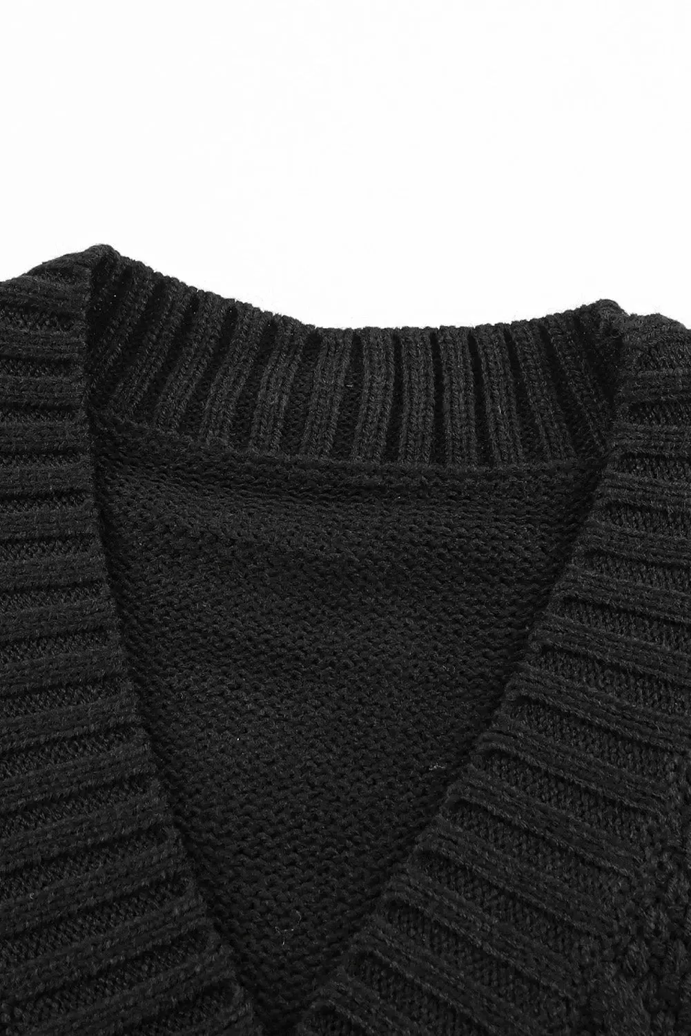 Elegant Textured Black Cardigan with Practical Pockets and Button Front